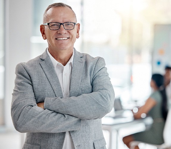 Middle-aged man at work wearing dentures