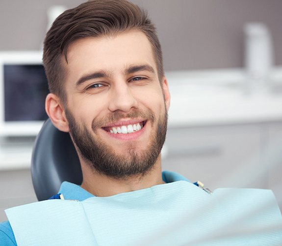 Male dental patient smiling after laser treatment of gum disease in Wilmington, IL